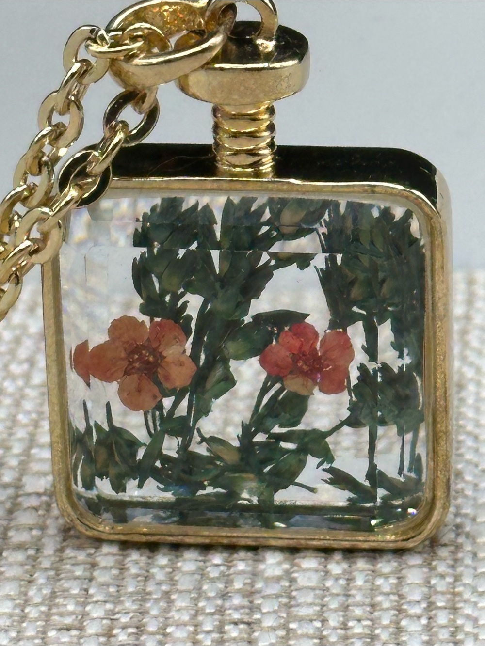 Dried pressed flowers in a glass perfume bottle styled pendant & long necklace